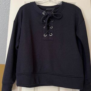 Dress up sweatshirt, Navy with silver toned grommets and ties in the front.